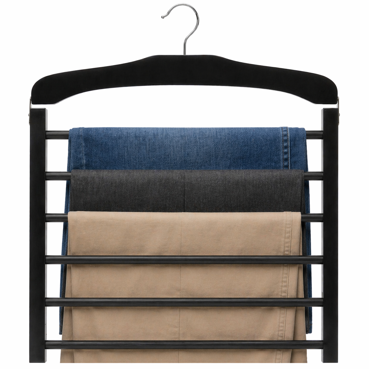 Black metal hanger with three pairs of pants on a white background