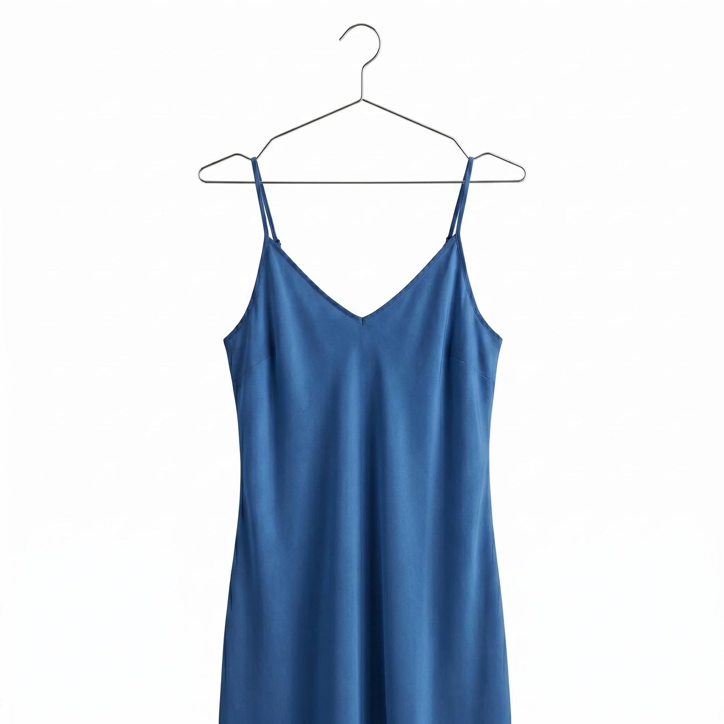 a Blue Dress hang on a metal chrome hanger against white background