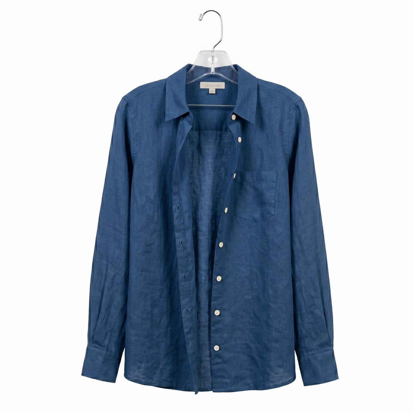 Blue shirt on a hanger against a white background