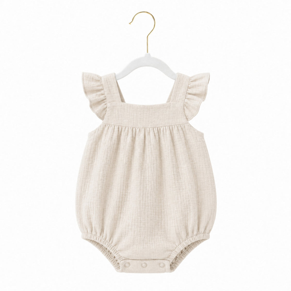 Beige baby romper with ruffled straps on a white background