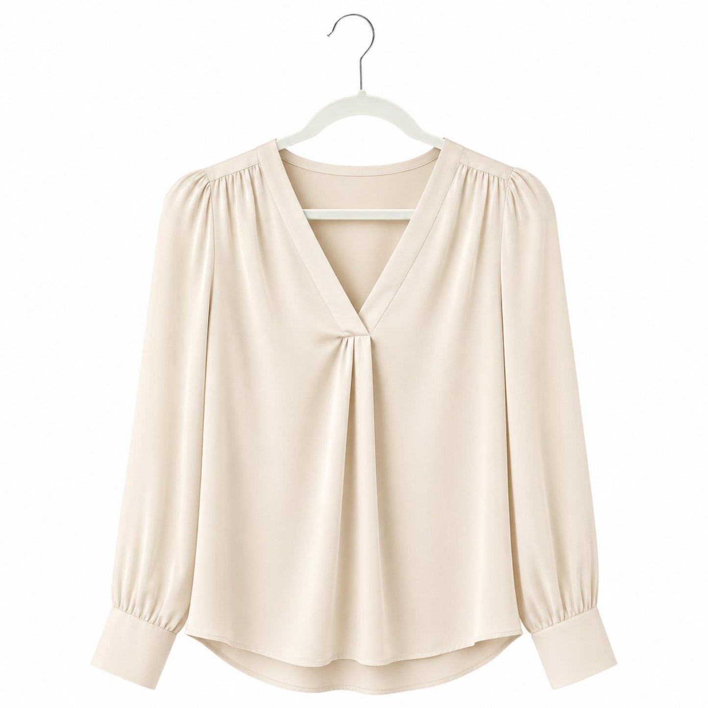 Beige blouse on a white hanger against a white background