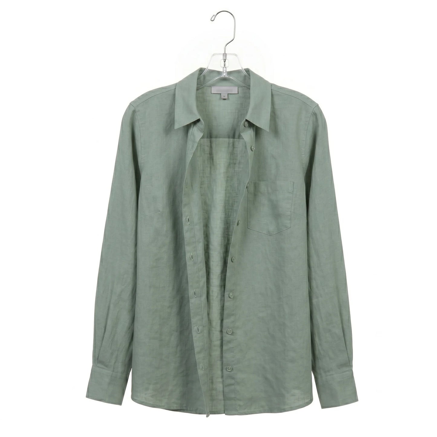 Green shirt on a hanger against a white background