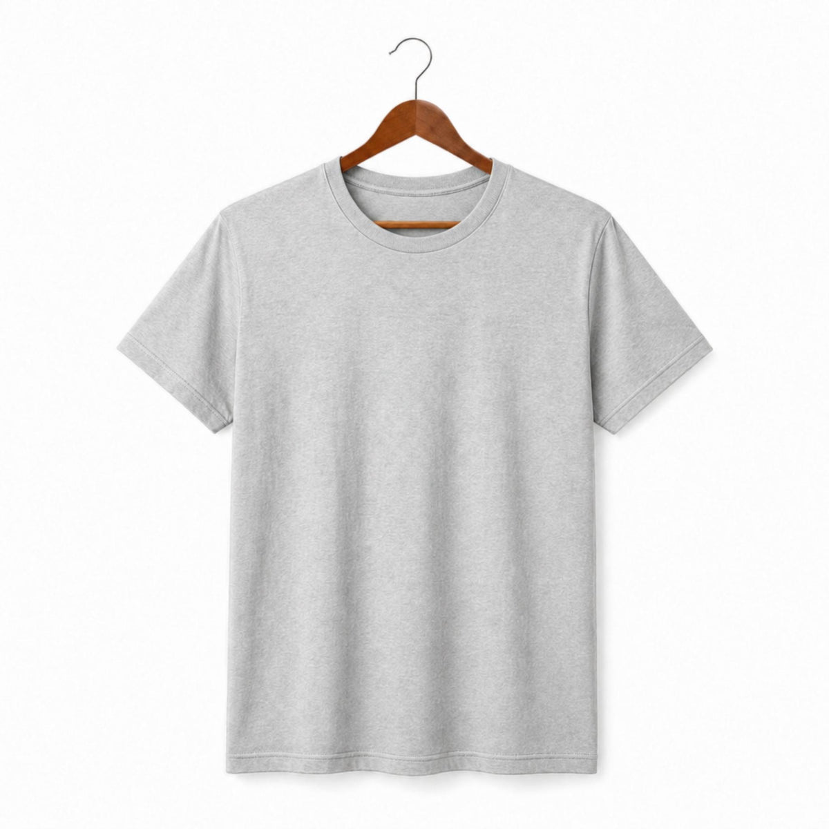 Gray t-shirt on a wooden hanger against a white background