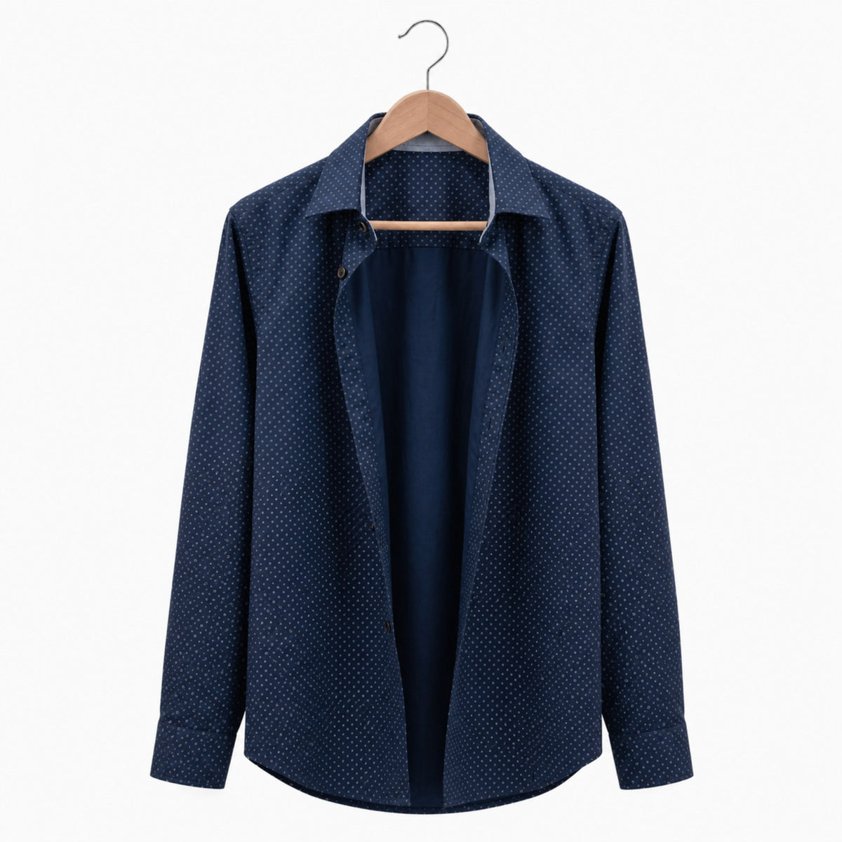 Navy blue patterned shirt on a hanger against a white background