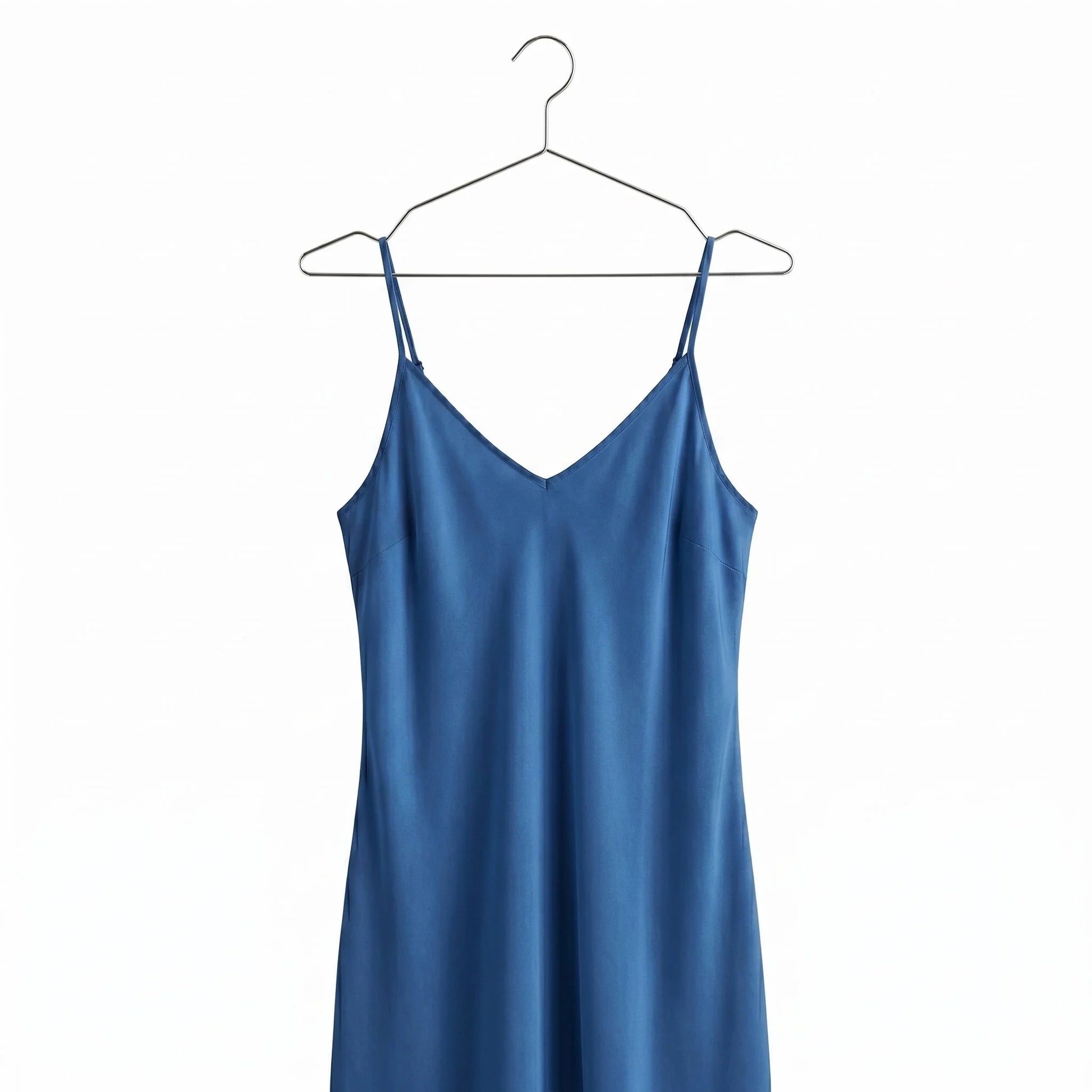 a Blue Dress hang on a metal chrome hanger against white background