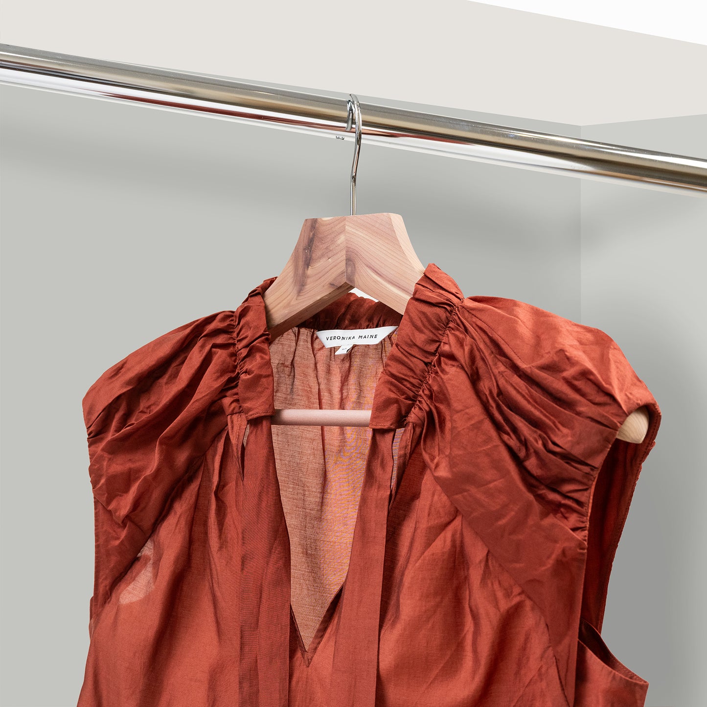 Brown garment on a cedar suit hanger 50mm thick shoulders