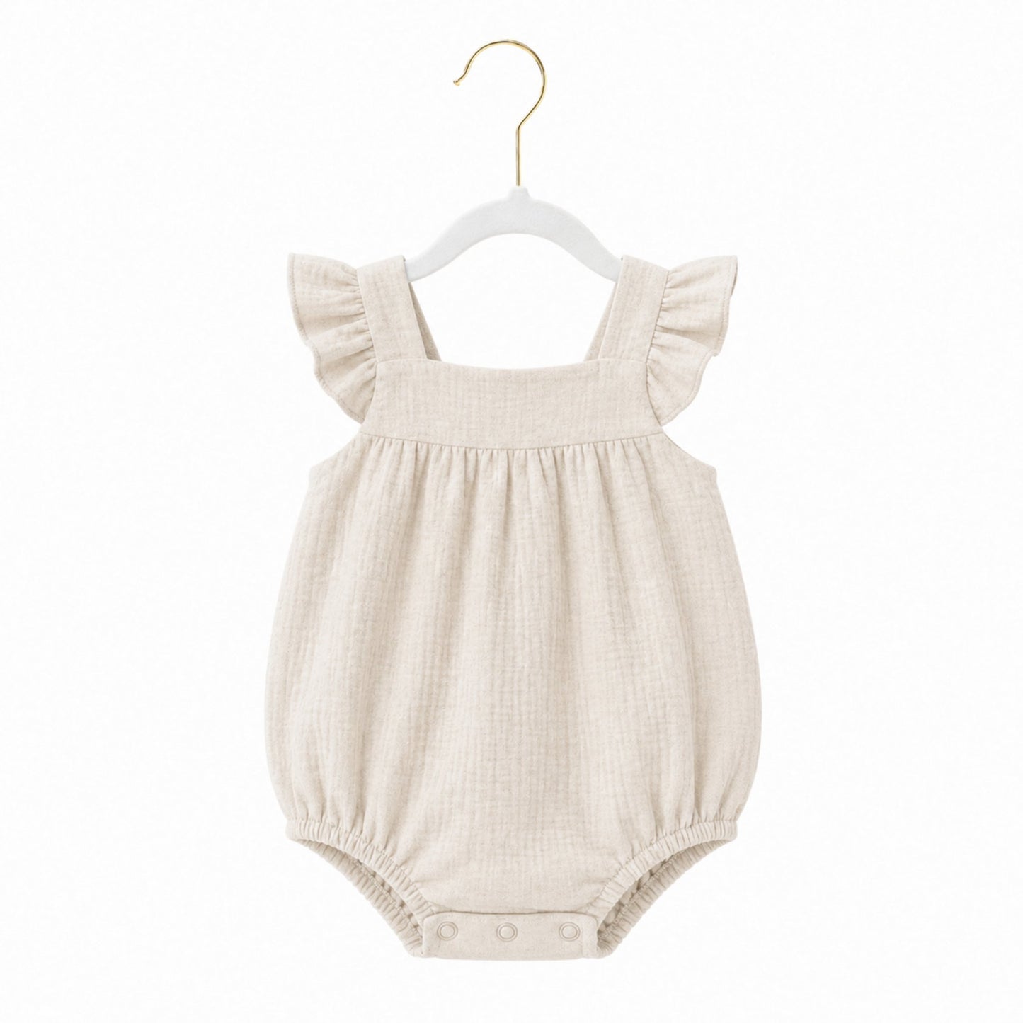 Beige baby romper with ruffled straps on a white background