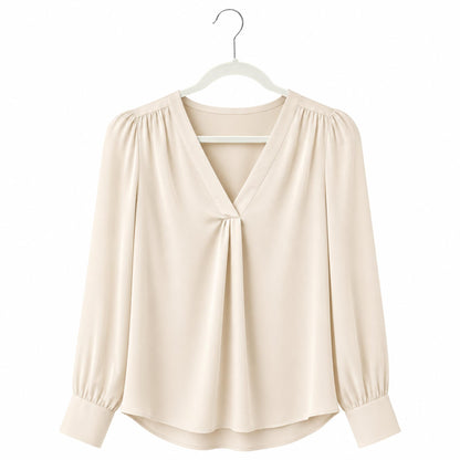Beige blouse on a white hanger against a white background