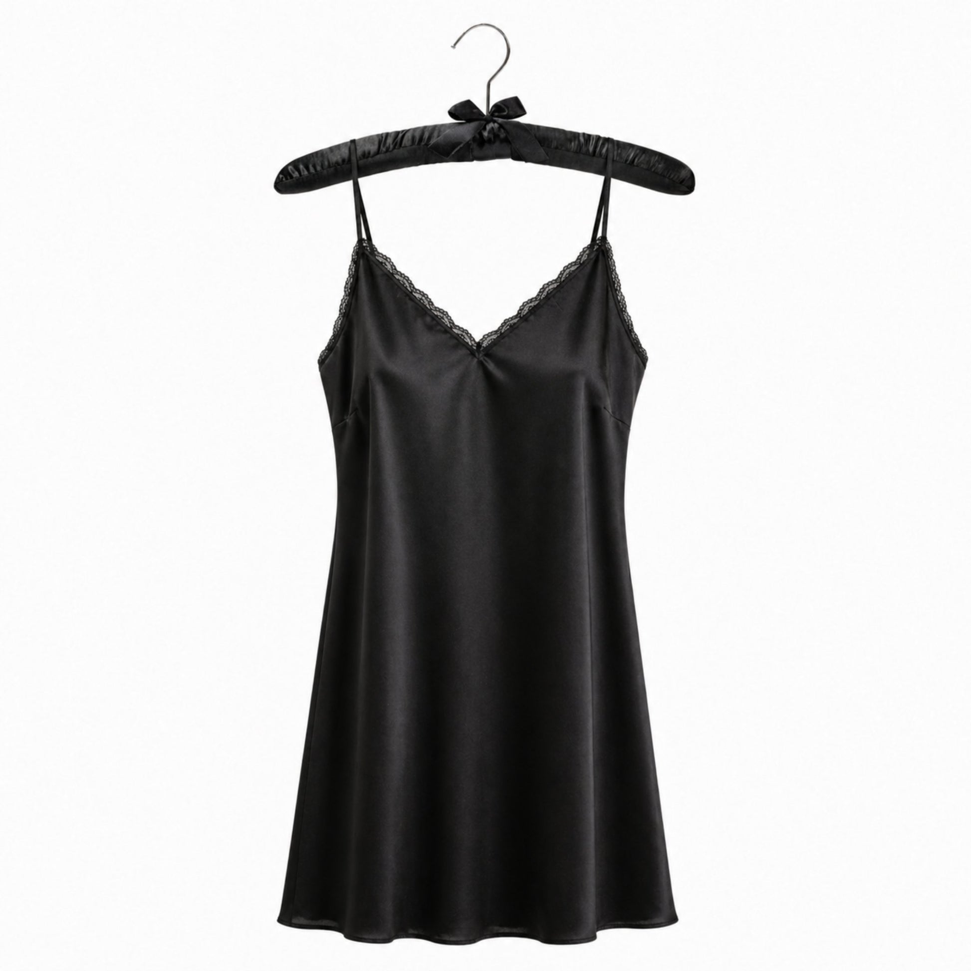 Black satin slip dress on a hanger against a white background