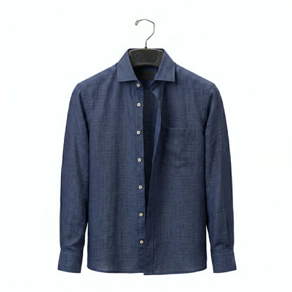 Blue shirt on a hanger against a white background