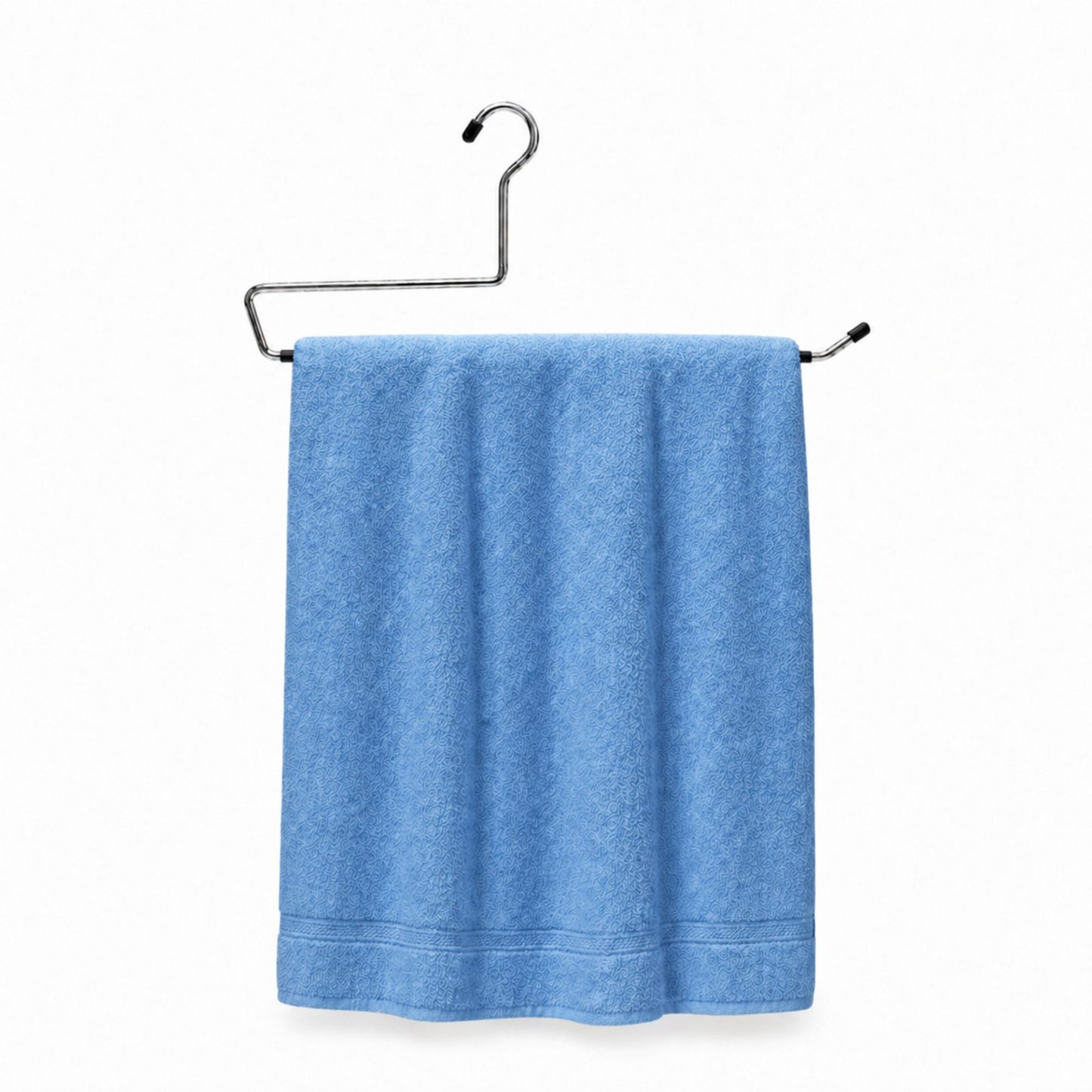 Blue towel hanging on a metal rack against a white background