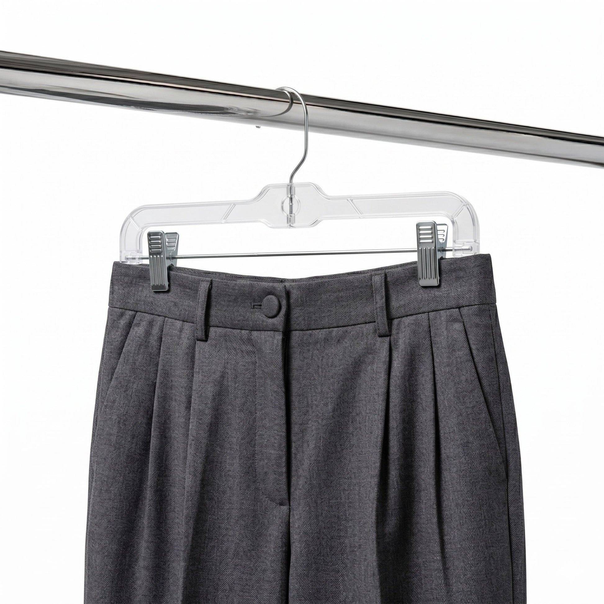 Gray pleated pants on a clear hanger against a white background