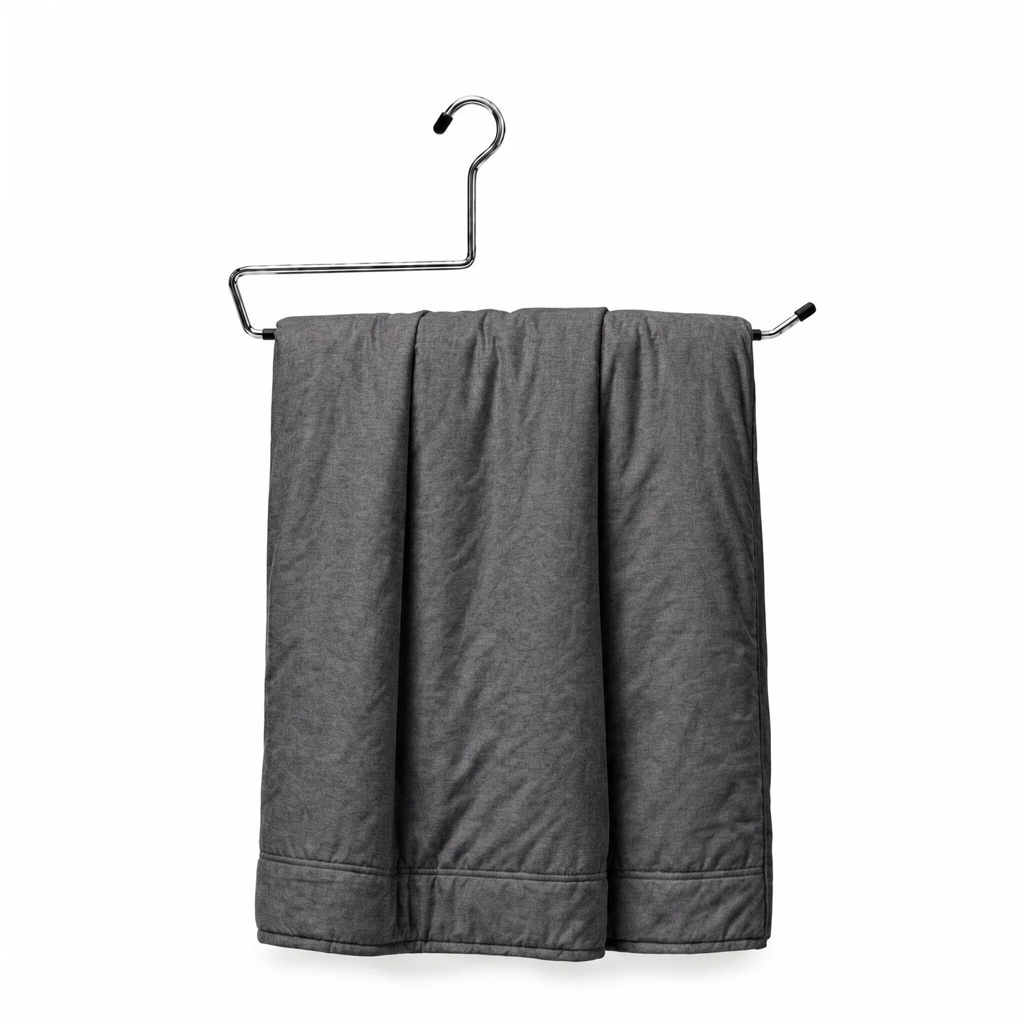Gray towel hanging on a metal rack against a white background