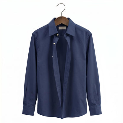 Blue shirt on a hanger against a white background