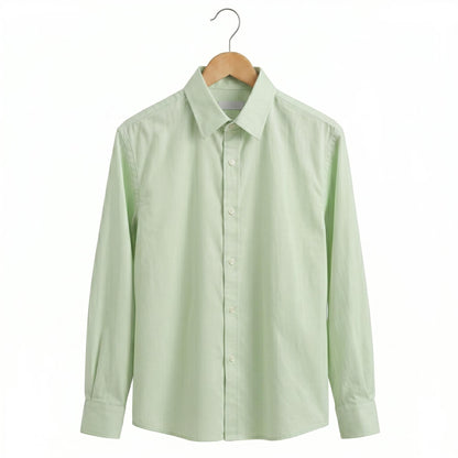 Light green shirt on a wooden hanger against a white background